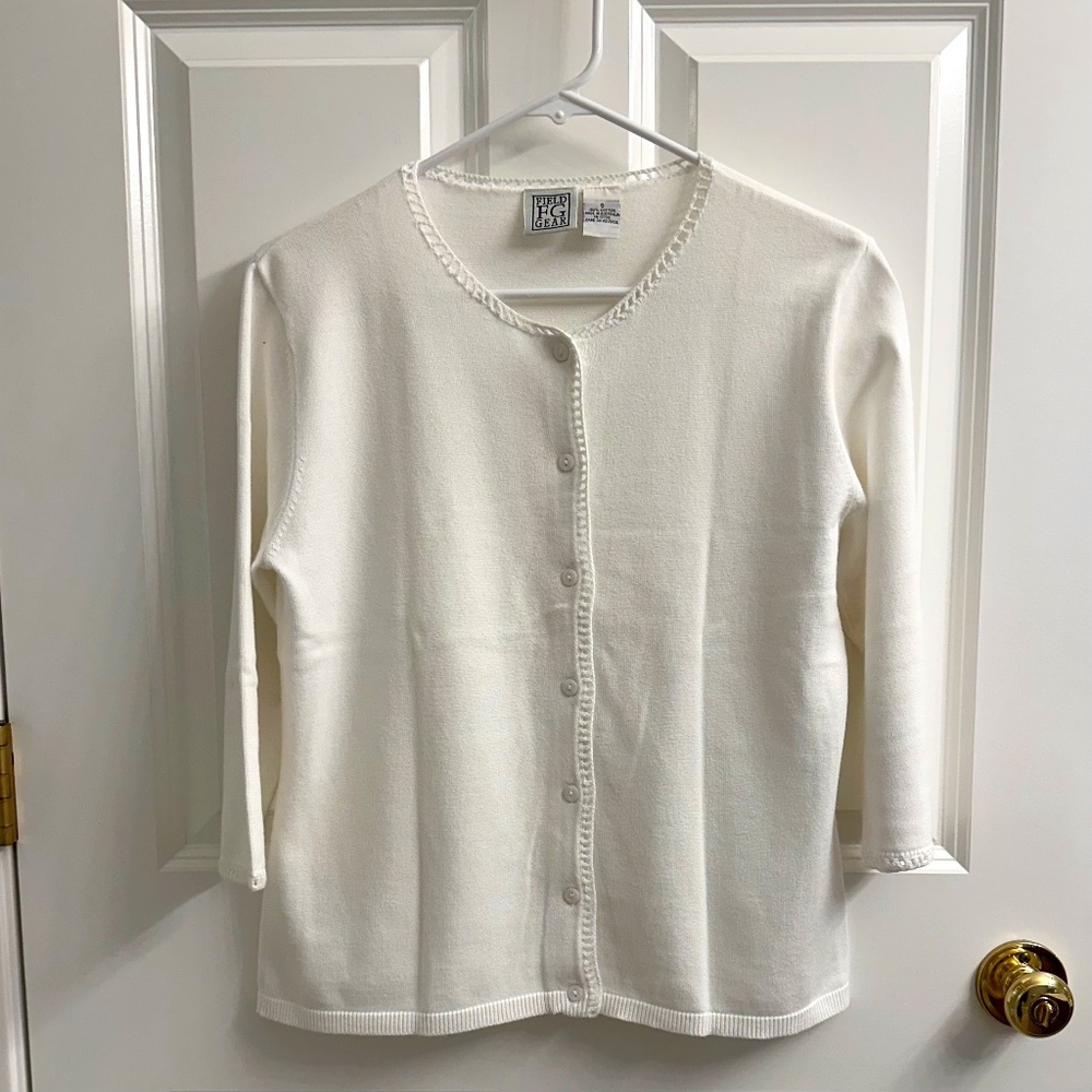 White sweater with crocheted edging detail